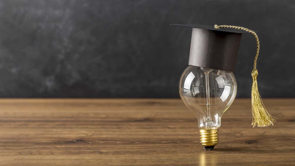 light-bulb-with-graduation-cap-copy-space